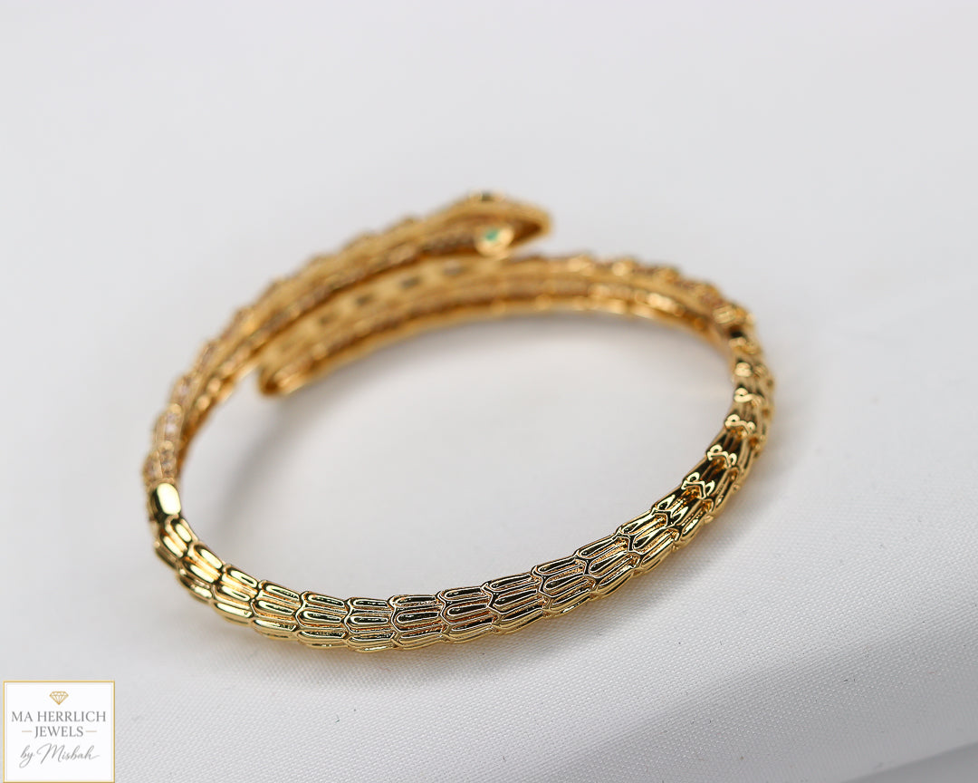 Green eyes and embellished with sparkling stones bracelet