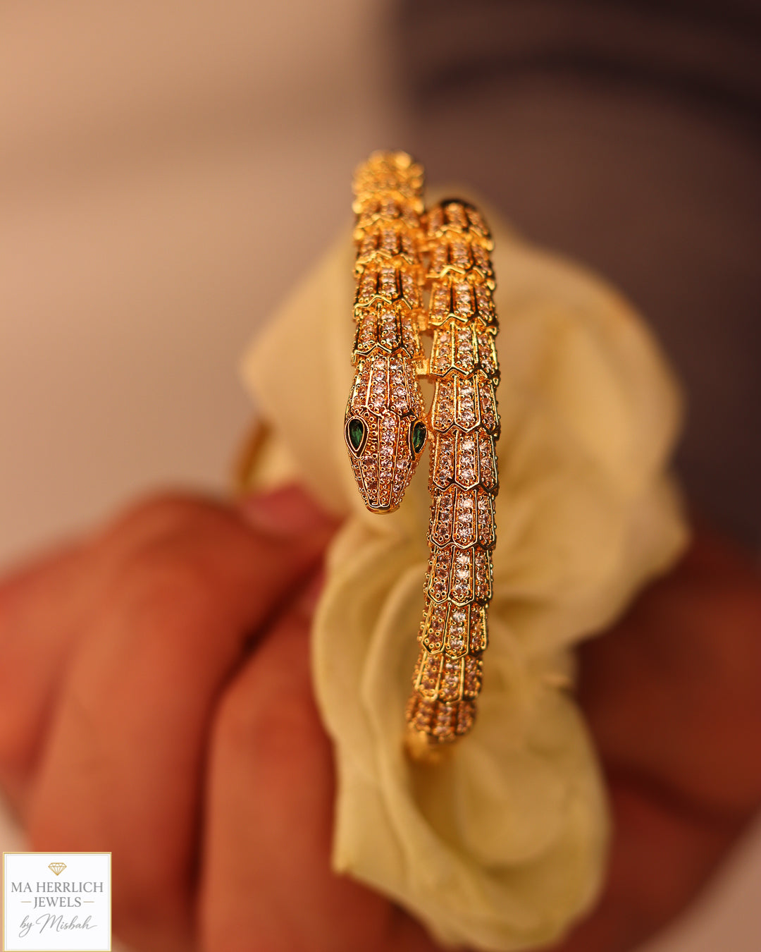 Green eyes and embellished with sparkling stones bracelet