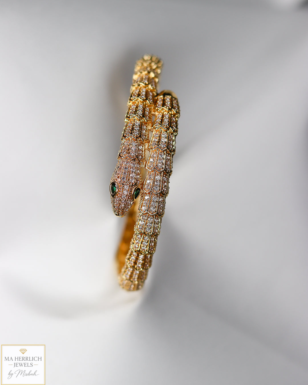 Green eyes and embellished with sparkling stones bracelet