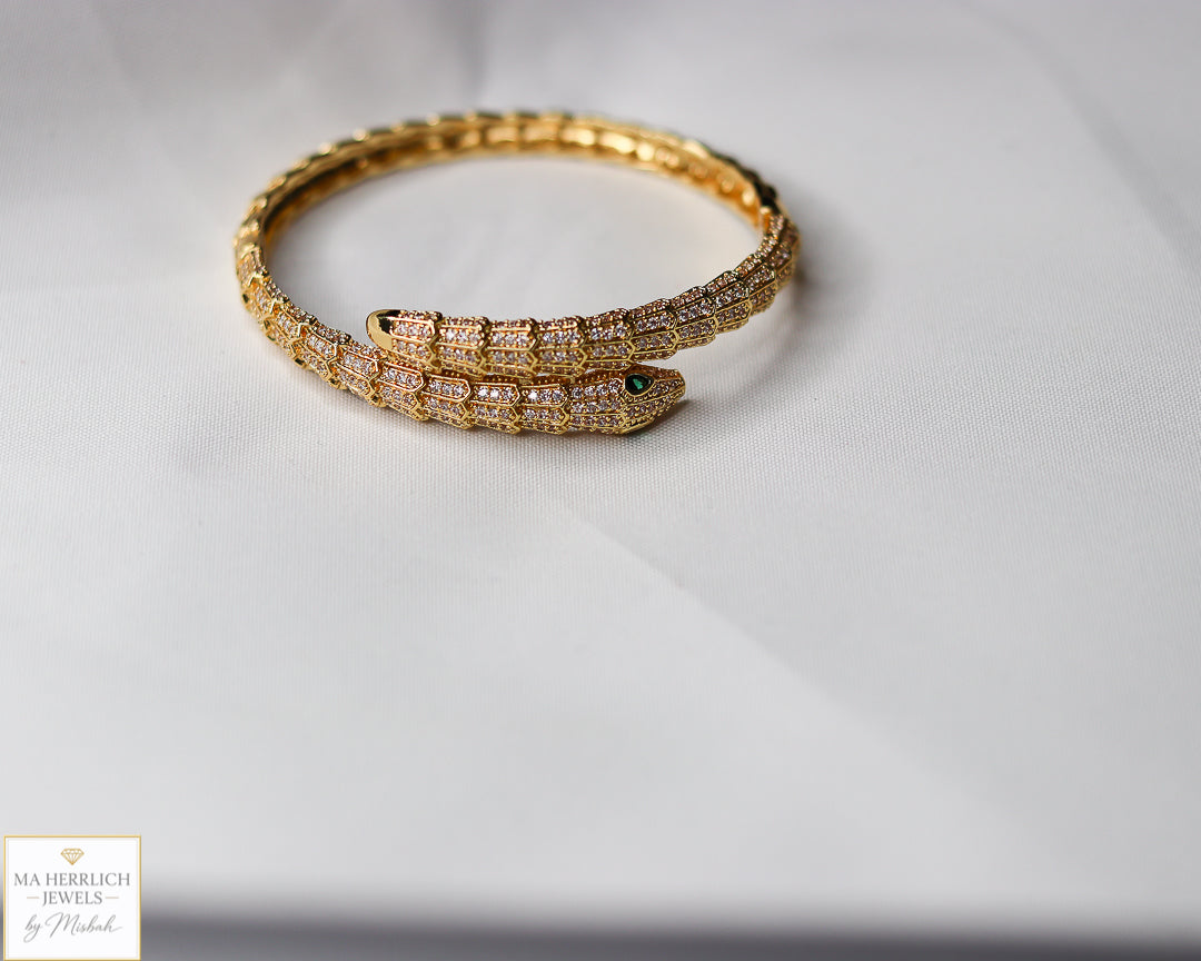 Green eyes and embellished with sparkling stones bracelet