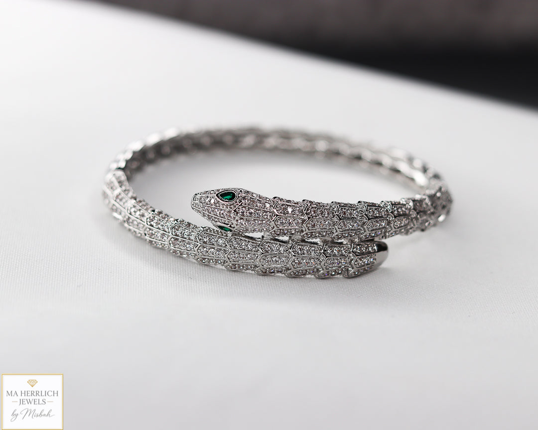 Green eyes and embellished with sparkling stones bracelet