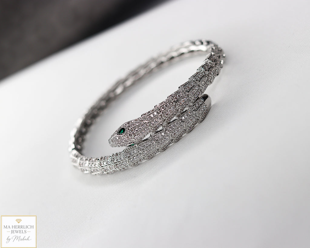 Green eyes and embellished with sparkling stones bracelet