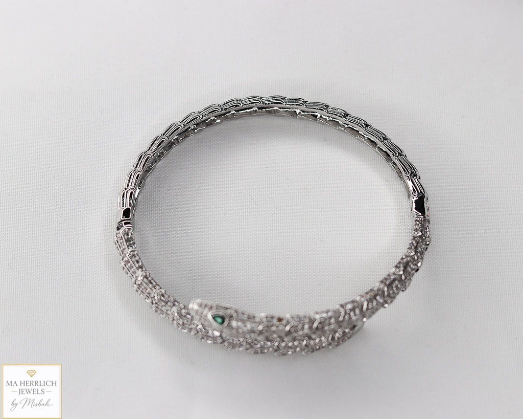 Green eyes and embellished with sparkling stones bracelet