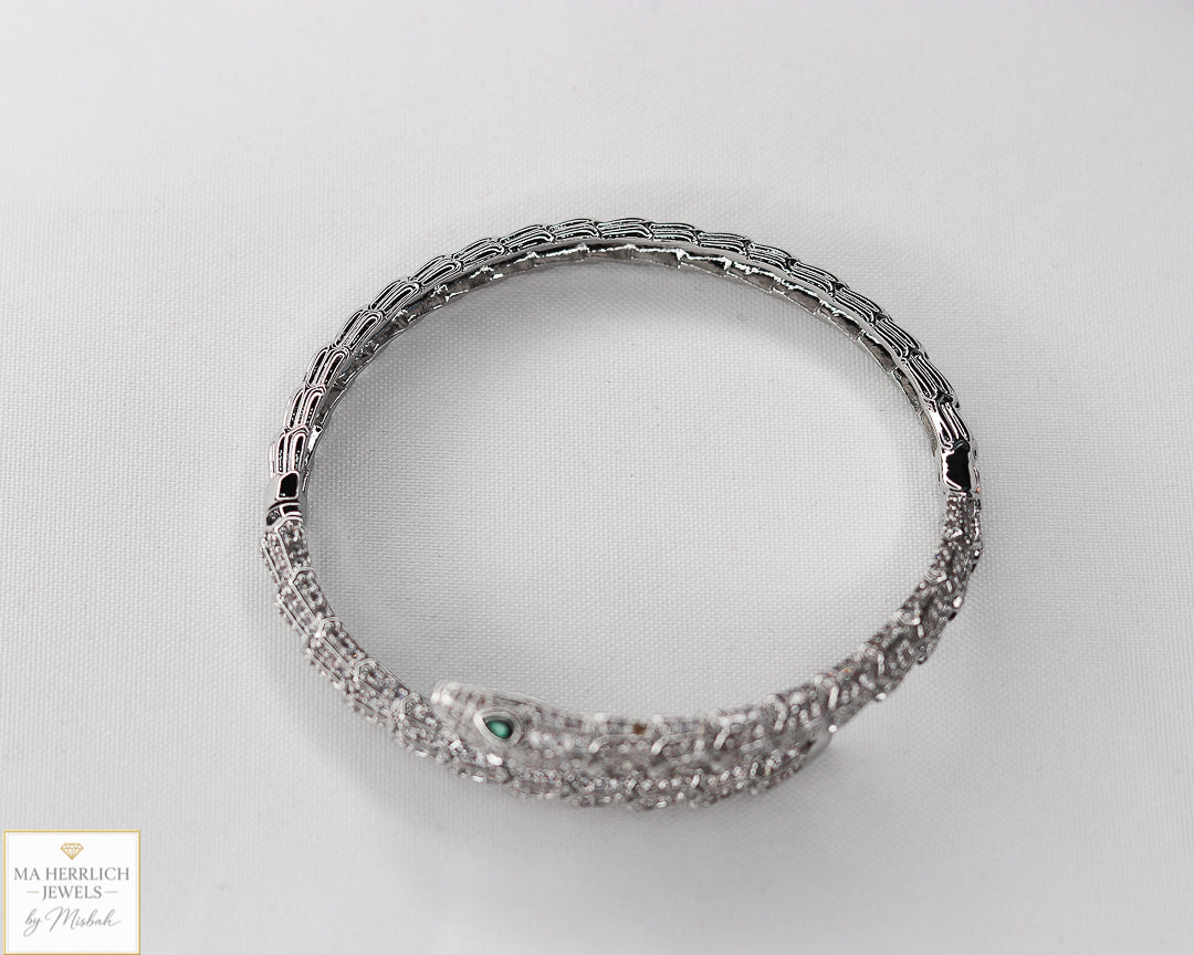 Green eyes and embellished with sparkling stones bracelet