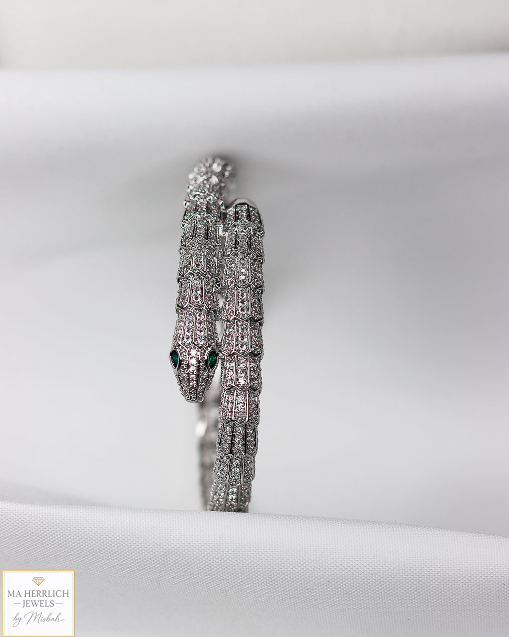 Green eyes and embellished with sparkling stones bracelet