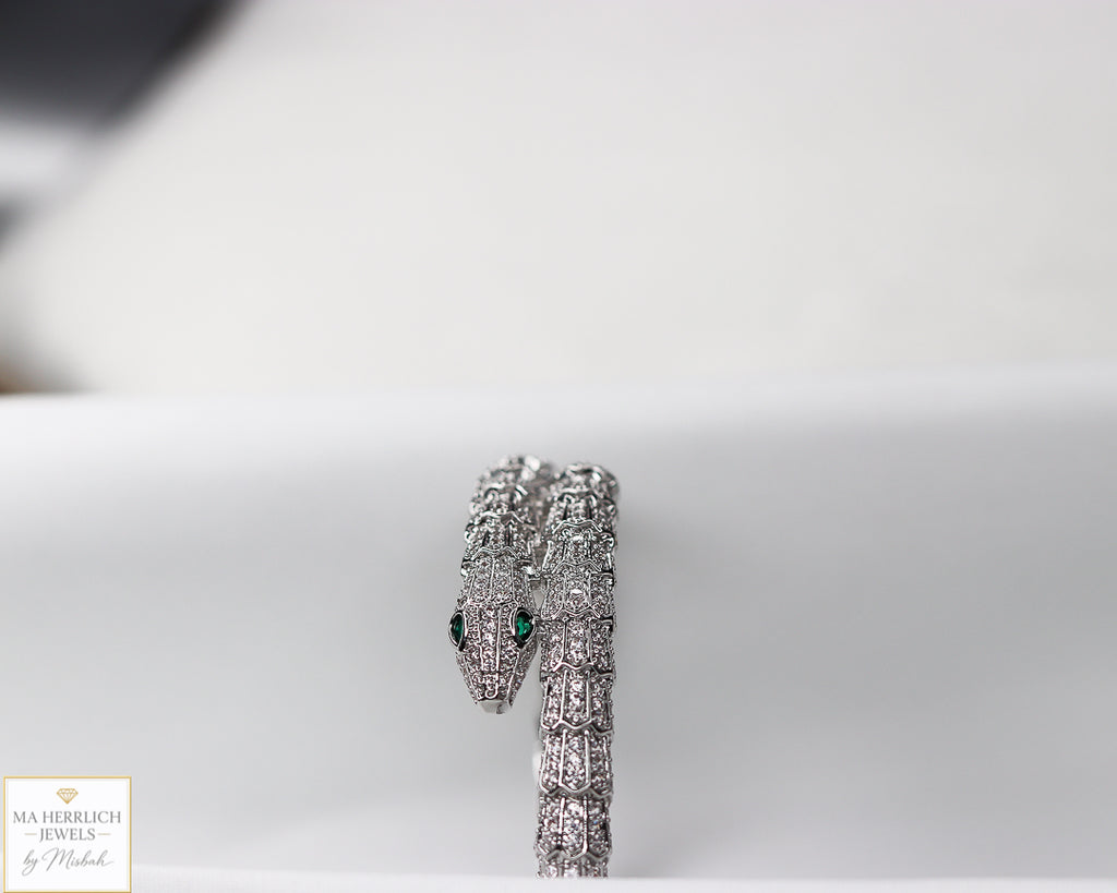 Green eyes and embellished with sparkling stones bracelet