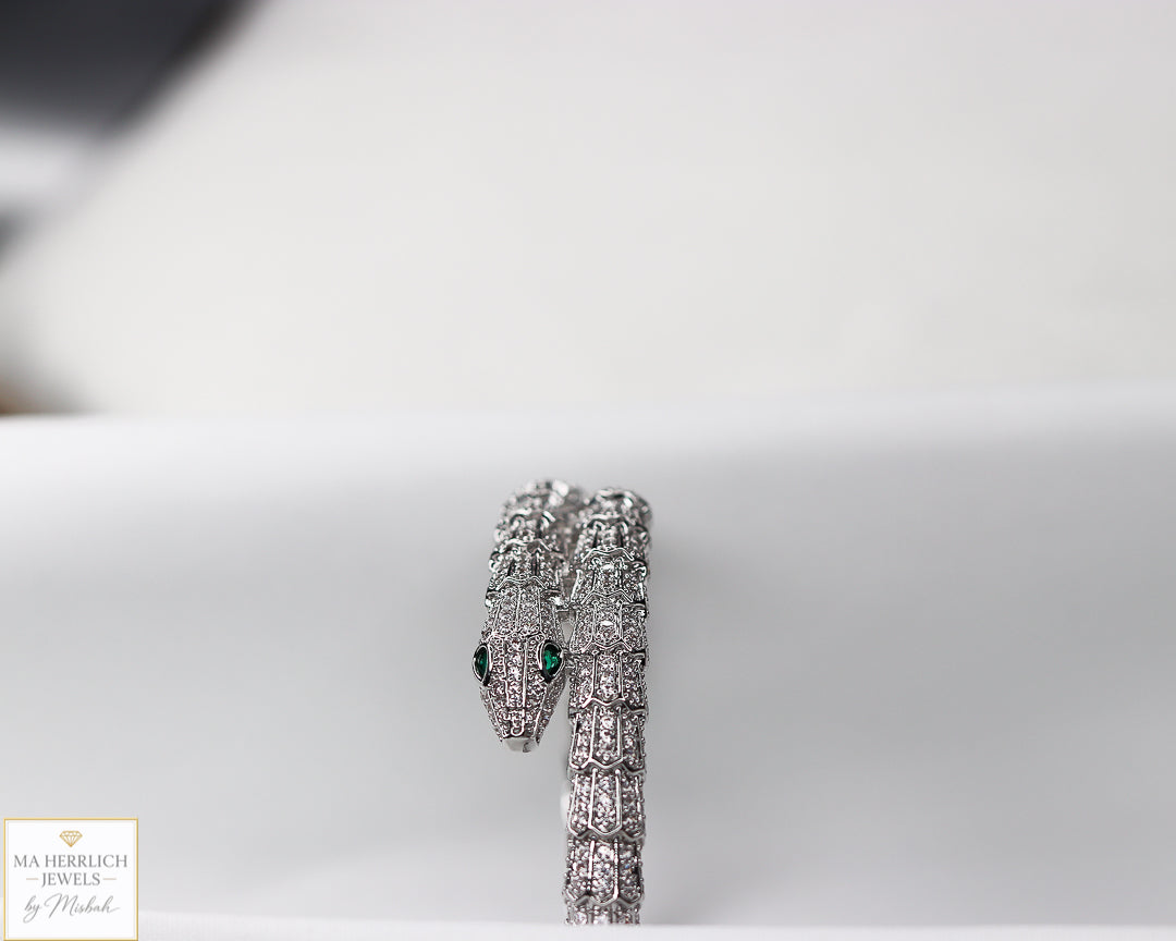 Green eyes and embellished with sparkling stones bracelet